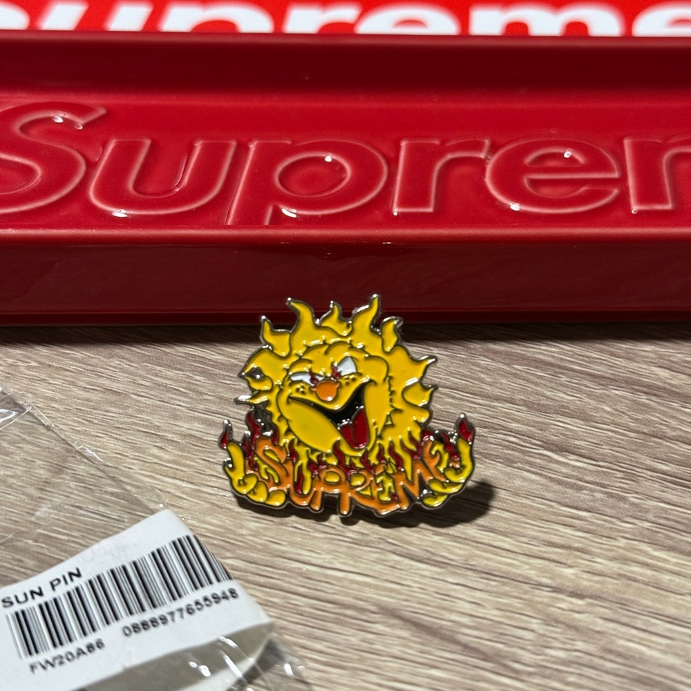 Supreme sun pin
